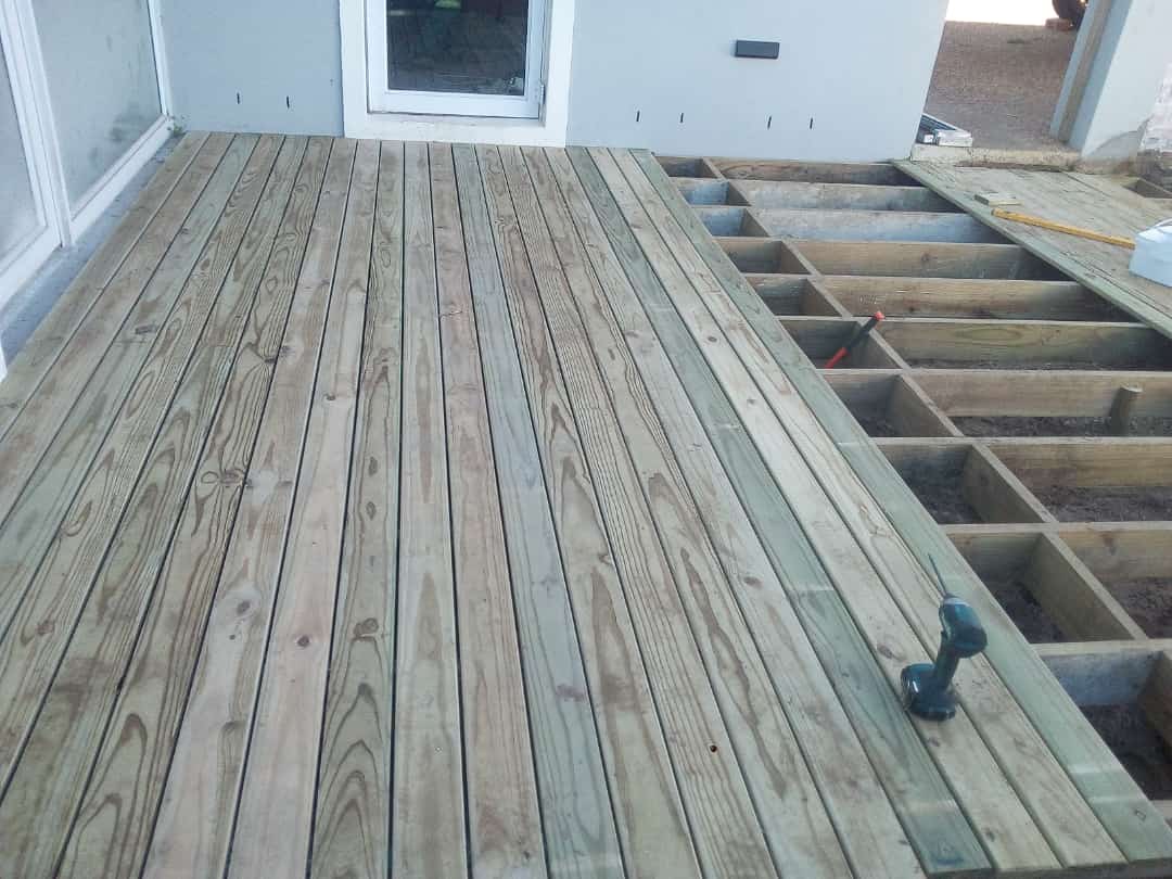 Timber deck partly boarded beside a Cape Town home