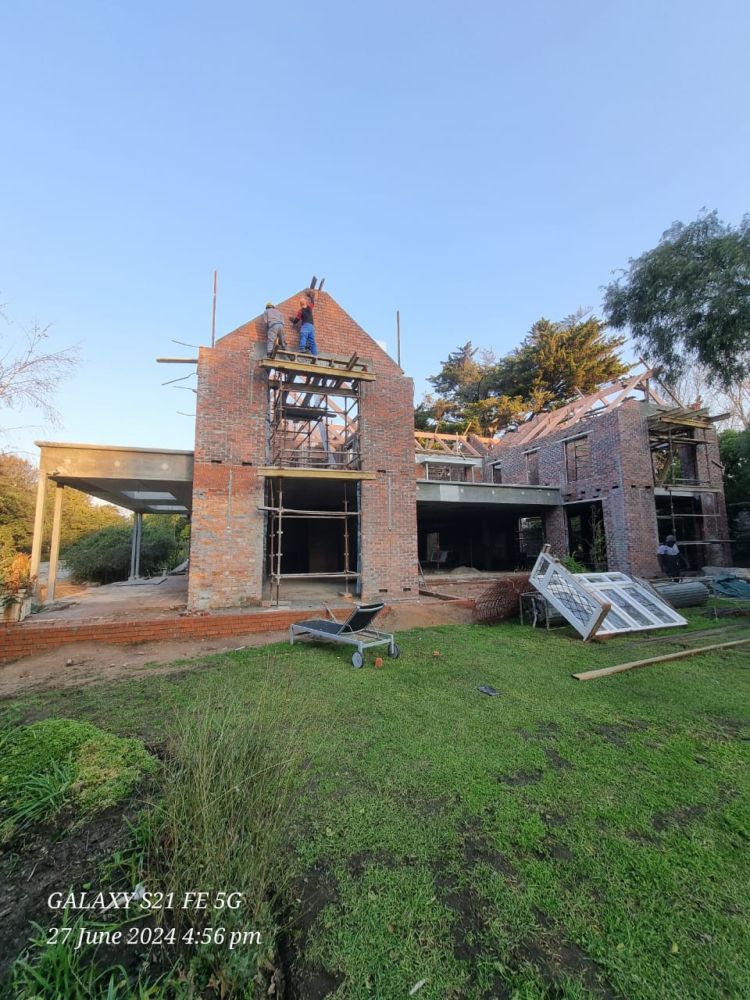 Brick gable building under construction with scaffolding