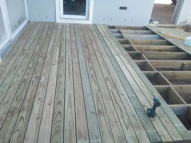 Timber deck boards laid over joists