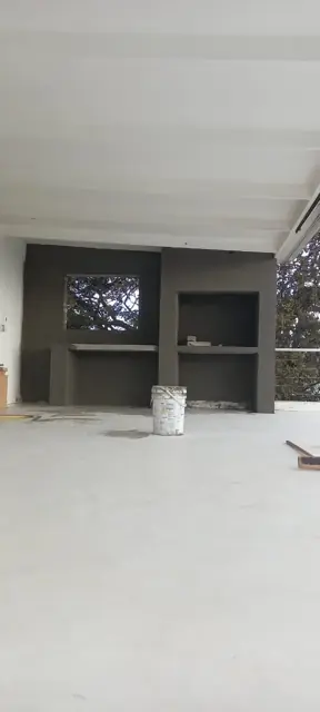Freshly plastered interior room, grey walls