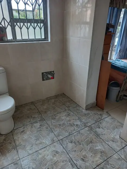 Bathroom floor and wall tiling in progress