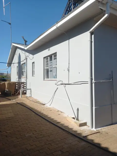 Freshly painted grey house exterior, completed