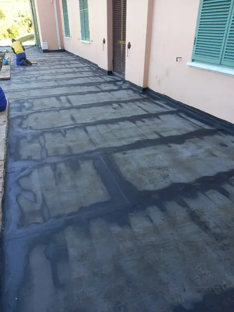Blue waterproofing membrane applied to a flat roof terrace