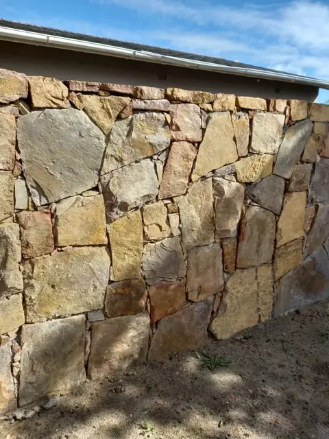 Natural stone cladding on an exterior wall, sandstone