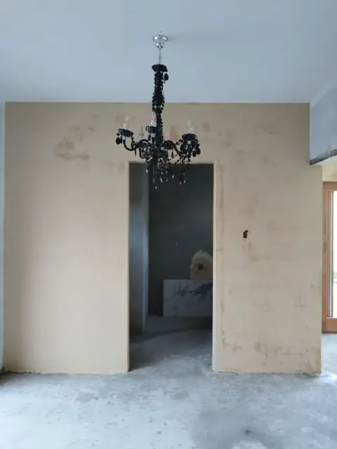 Skimmed room interior with chandelier fitting