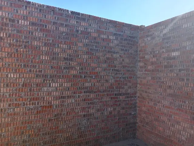 Corner of new face-brick walls on an extension