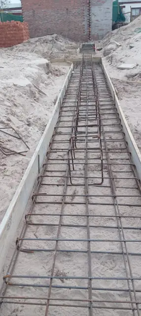Concrete strip foundation with steel rebar cage