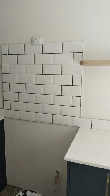 White subway-tile kitchen splashback