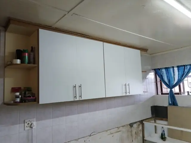 White kitchen wall cabinets newly installed