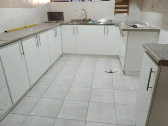 Completed white kitchen cabinets with countertops