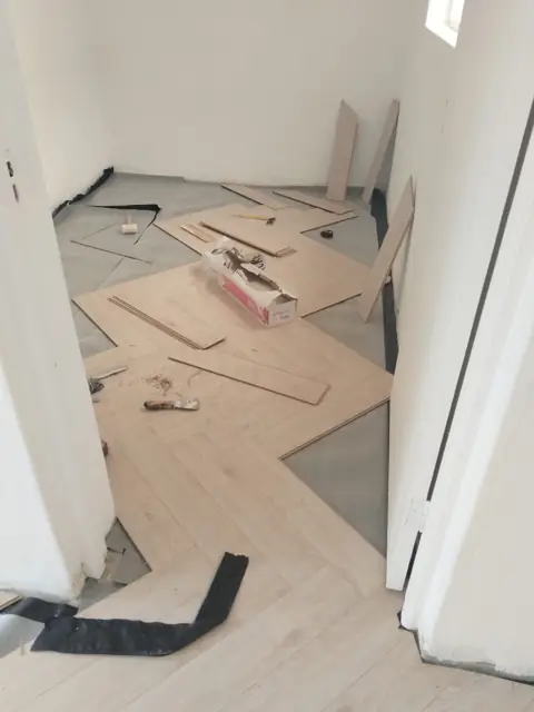 Fitting herringbone flooring in passage