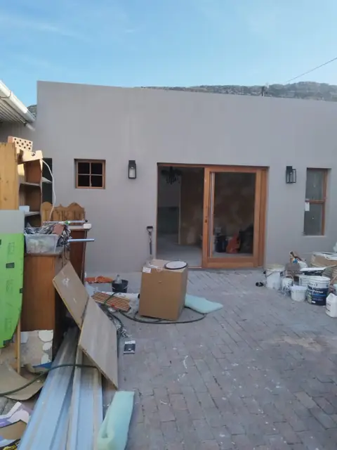 Courtyard of new build with timber doors fitted