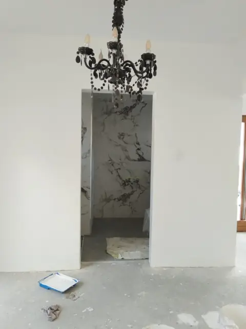 Skimmed archway interior with chandelier