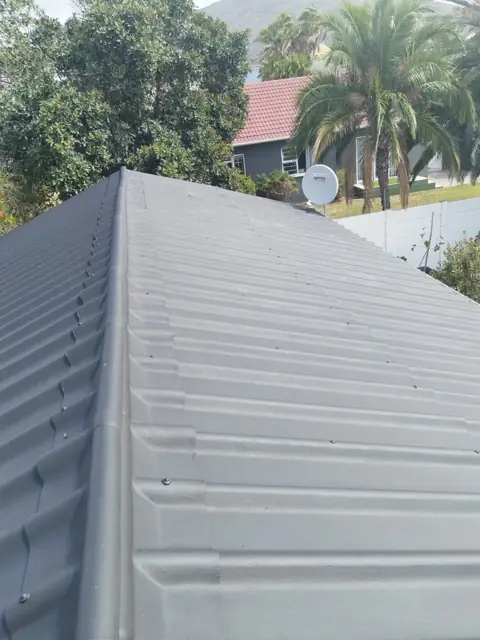 Finished ridge capping on recoated roof