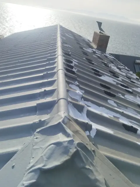 Ridge sealing detail on coastal roof