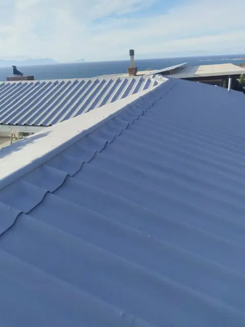 Recoated blue-grey roof by the sea