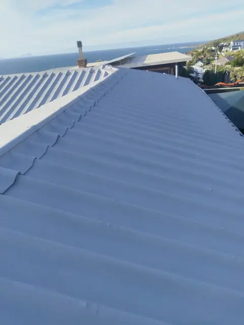 Completed roof coating with ocean backdrop