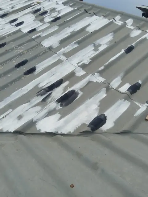 Roof sheets with primer patches before final coat