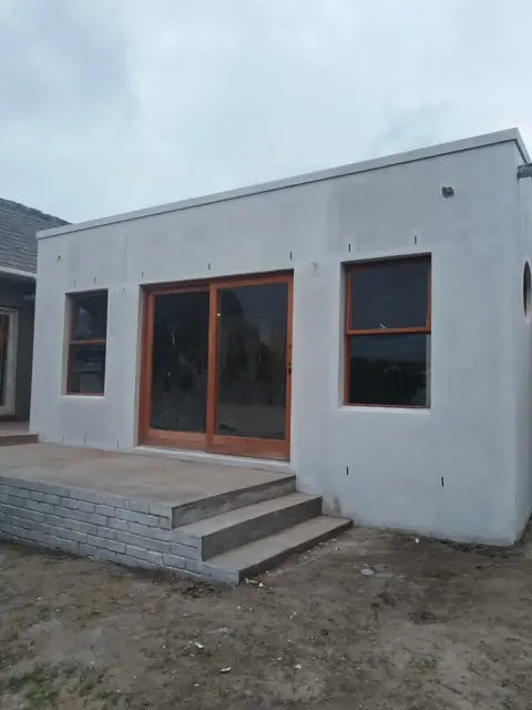 New build rear elevation with steps and timber windows
