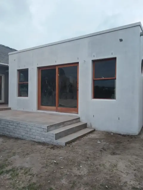 New build rear entrance with paved steps