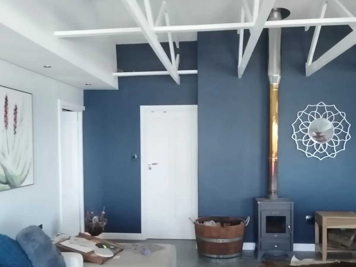 Finished living room renovation with feature wall by I.B.S Construction