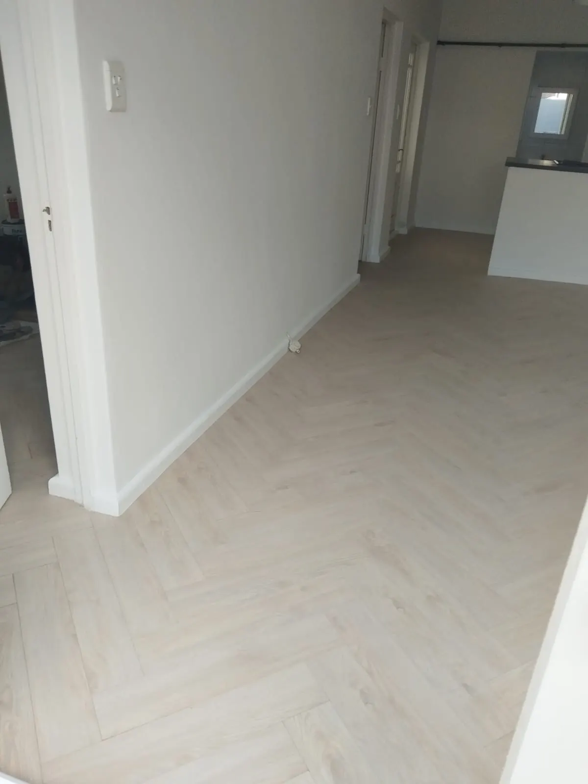 Completed herringbone floor in open living area