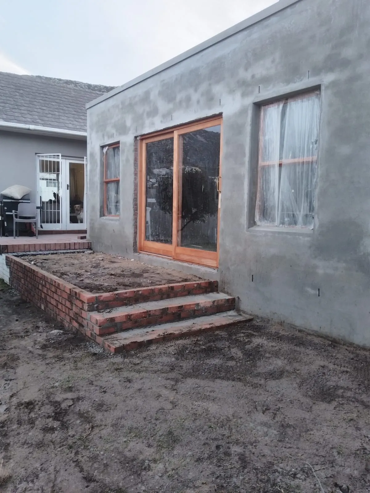 Plastered walls and brick steps during renovation